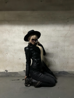 UBORYA Black Slouchy Knee-High Boots with Buckle Straps and Sculptural Heel