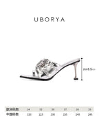 UBORYA Silver Metallic Multi-Buckle Mules with Skull Studs