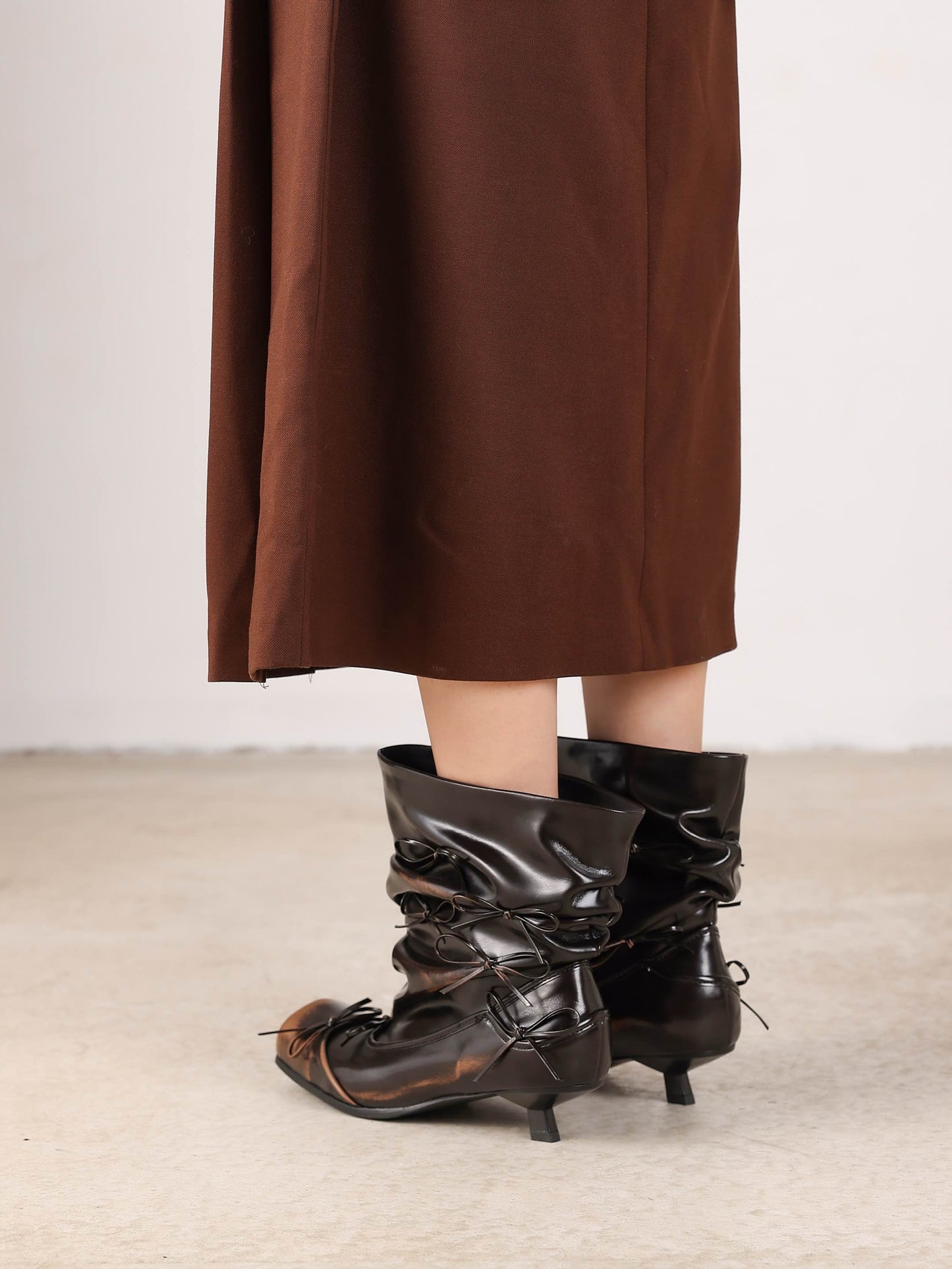 UBORYA Black Slouchy Ankle Boots with Bows – Distressed Square Toe Heeled Boots for Women | Ruched Shaft | Mini Bow Accents | Grunge Avant-Garde Booties