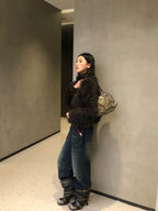 UBORYA Black Slouchy Knee-High Boots with Buckle Straps and Sculptural Heel